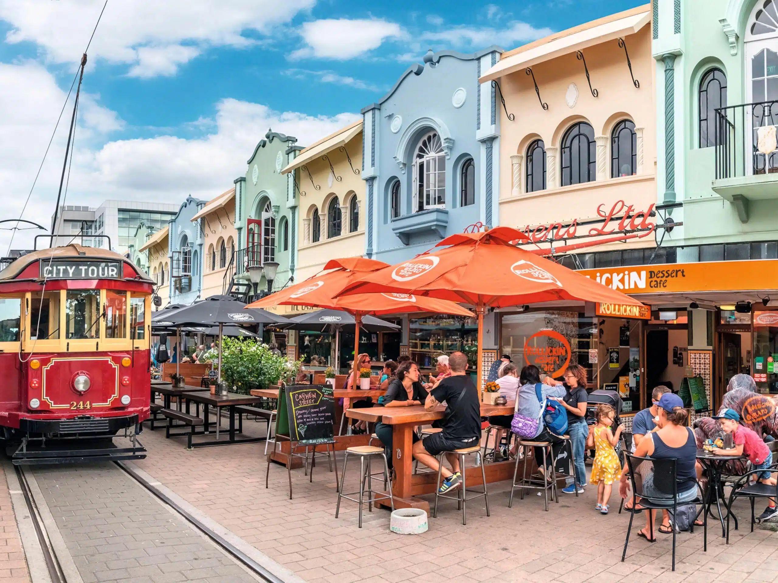 A scenic view of Christchurch, New Zealand, featuring the city skyline and the Port Hills in the background.